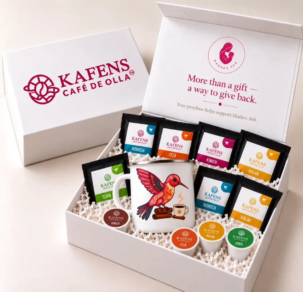 [Each Gift Box Includes:  - **1 collectible KAFENS 12 oz enamel mug** with a silver rim, featuring your selected animal design. - **5 individually wrapped café de olla pour-over servings:** NOHOCH, ITZÁ, KALAK, and COBÁ. - **5 individually wrapped café de olla steeping bags (teabag style):** NOHOCH, ITZÁ, KALAK, and COBÁ. - **4 café de olla K-Cup pods.** - **4 exclusive KAFENS stickers.** - **An elegant gift box** with decorative paper filling and a special Madres 360 message inside the lid.  **Please Note:** Coffee flavor assortment may vary based on availability. Total quantity and product formats remain as described.] The Inspirer Gift Box - Pre order